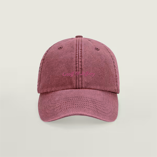 Front view of Geoff & Jeffrey vintage Strawberry Red dad cap with pink embroidery