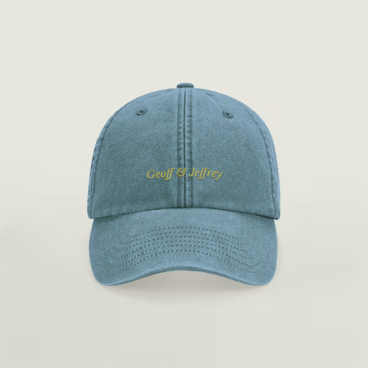 Front view of Geoff & Jeffrey vintage denim blue dad cap with yellow embroidery