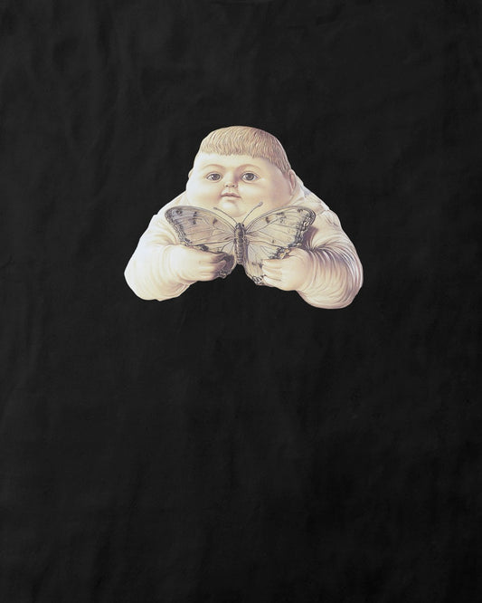 Close up of a women's soft pink organic cotton Geoff & Jeffrey t-shirt with a mall graphic print of a jolly, proud boy (Geoff) holding a butterfly. The t-shirt has a cute silly aesthetic.