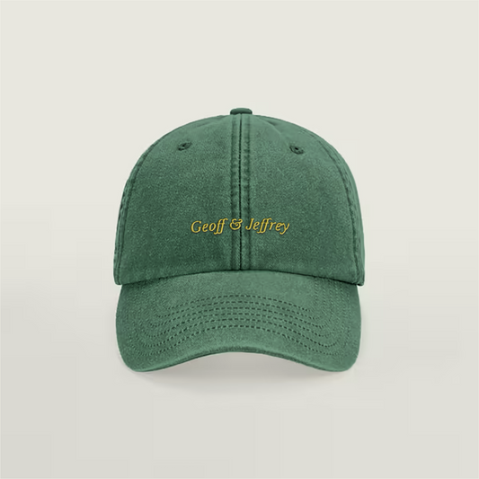 Front view of Geoff & Jeffrey vintage bottle green dad cap with yellow embroidery