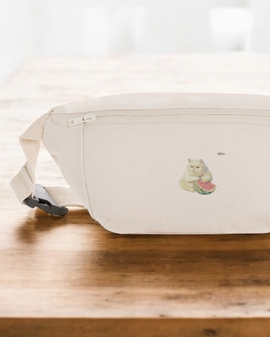 White waist bag with a small design on a wooden surface