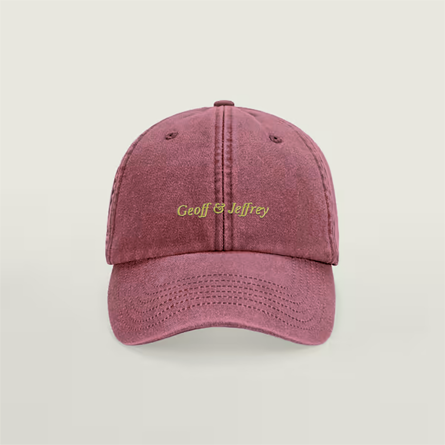 Front view of Geoff & Jeffrey vintage Strawberry Red dad cap with yellow embroidery