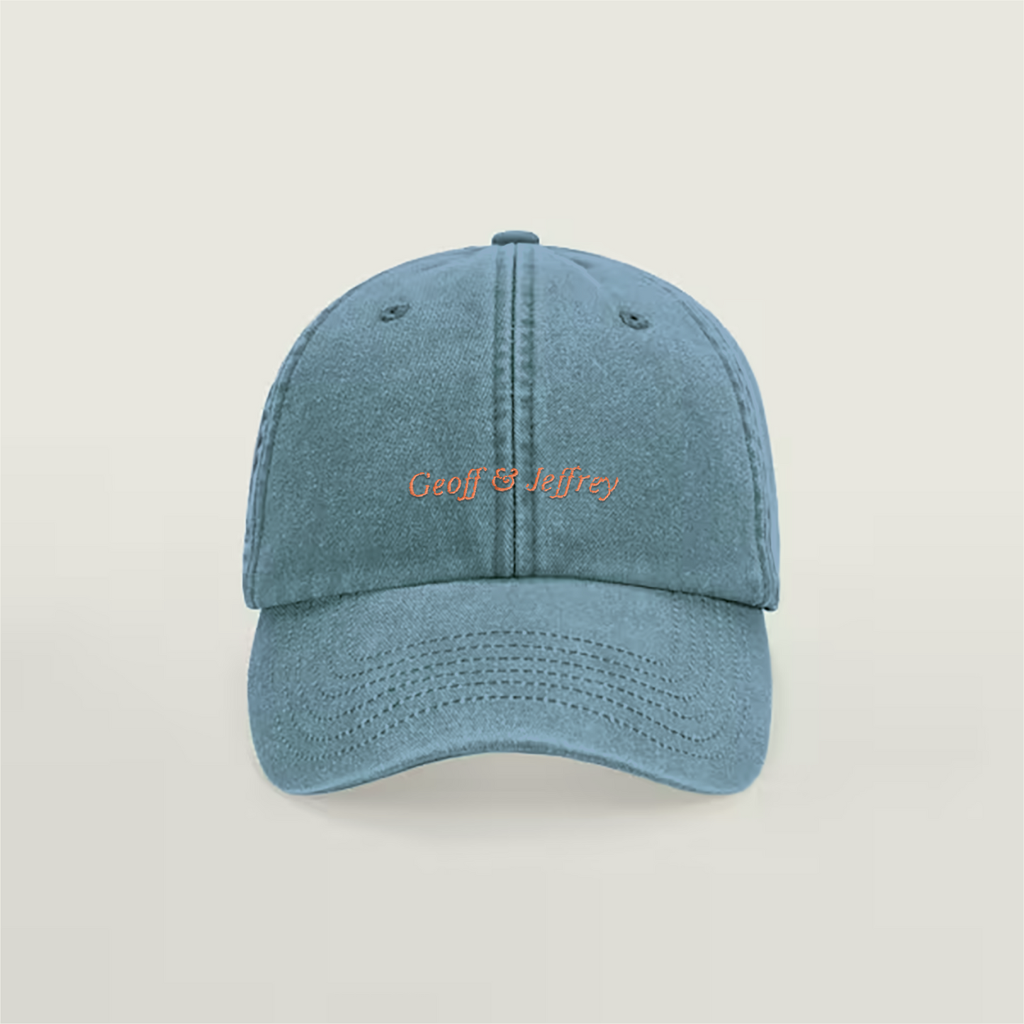 Front view of Geoff & Jeffrey vintage denim blue dad cap with orange embroider