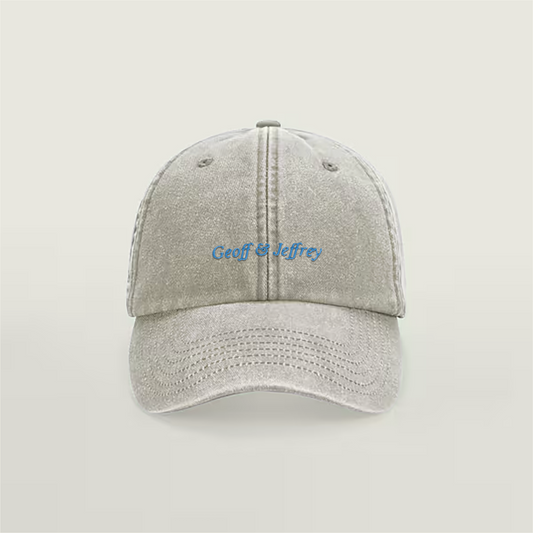 Front view of Geoff & Jeffrey vintage sand dad cap with blue embroidery