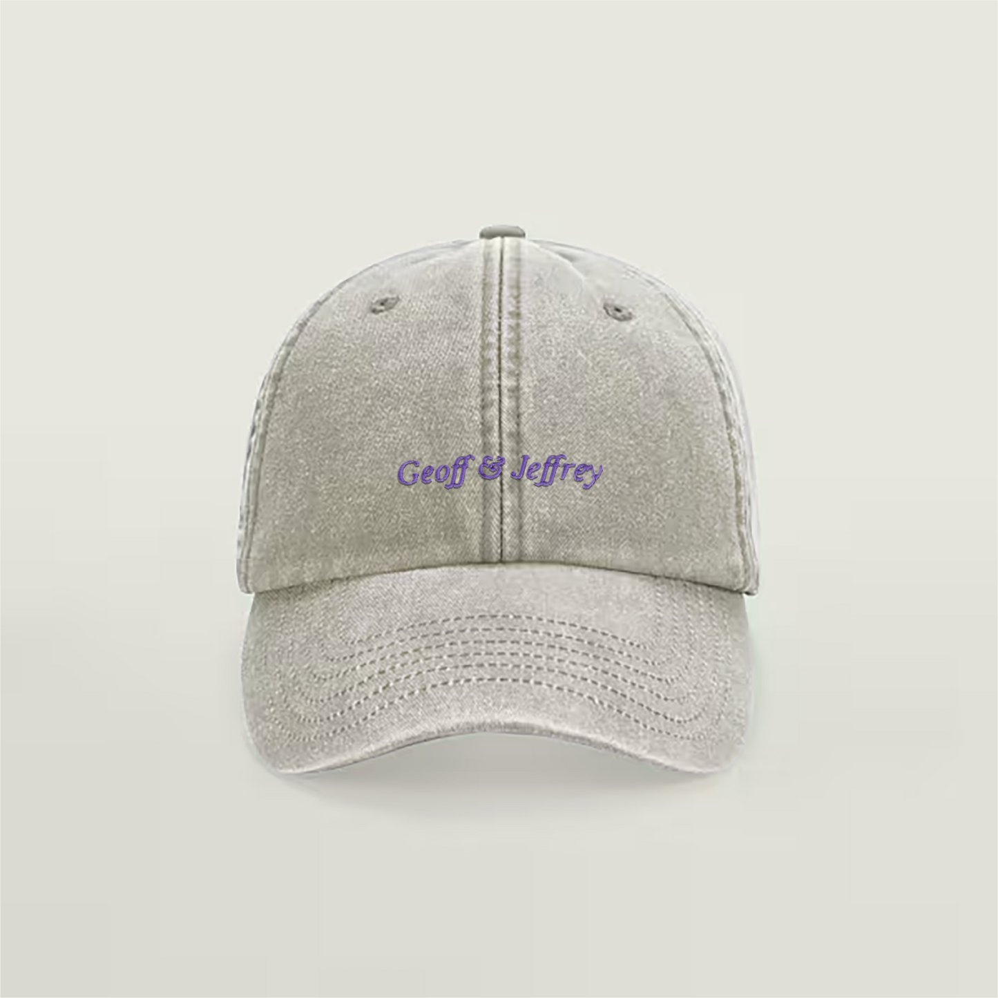 Front view of Geoff & Jeffrey vintage sand dad cap with purple embroidery