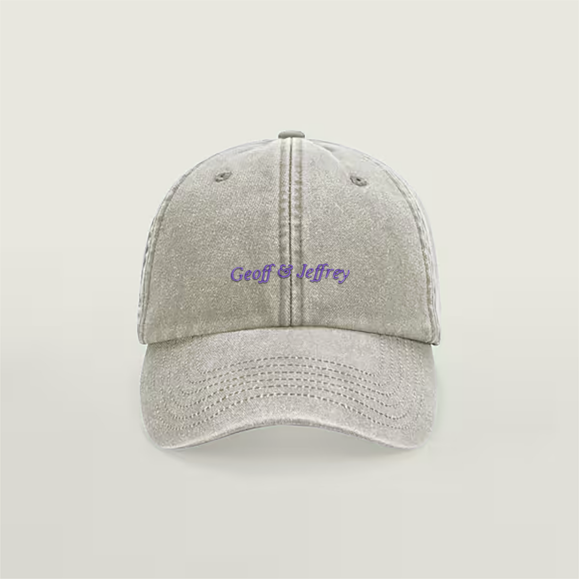 Front view of Geoff & Jeffrey vintage sand dad cap with purple embroidery
