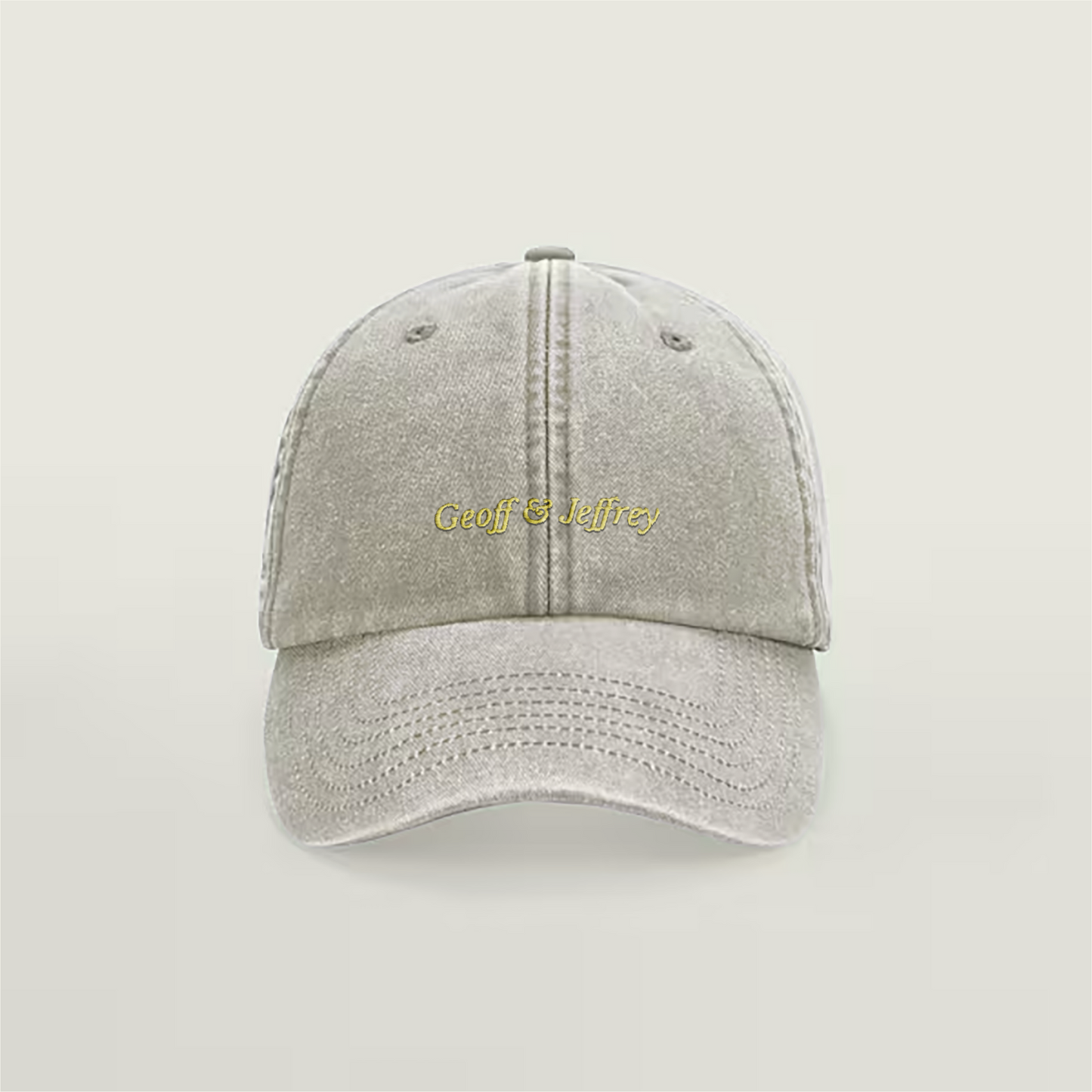 Front view of Geoff & Jeffrey vintage sand dad cap with yellow embroidery