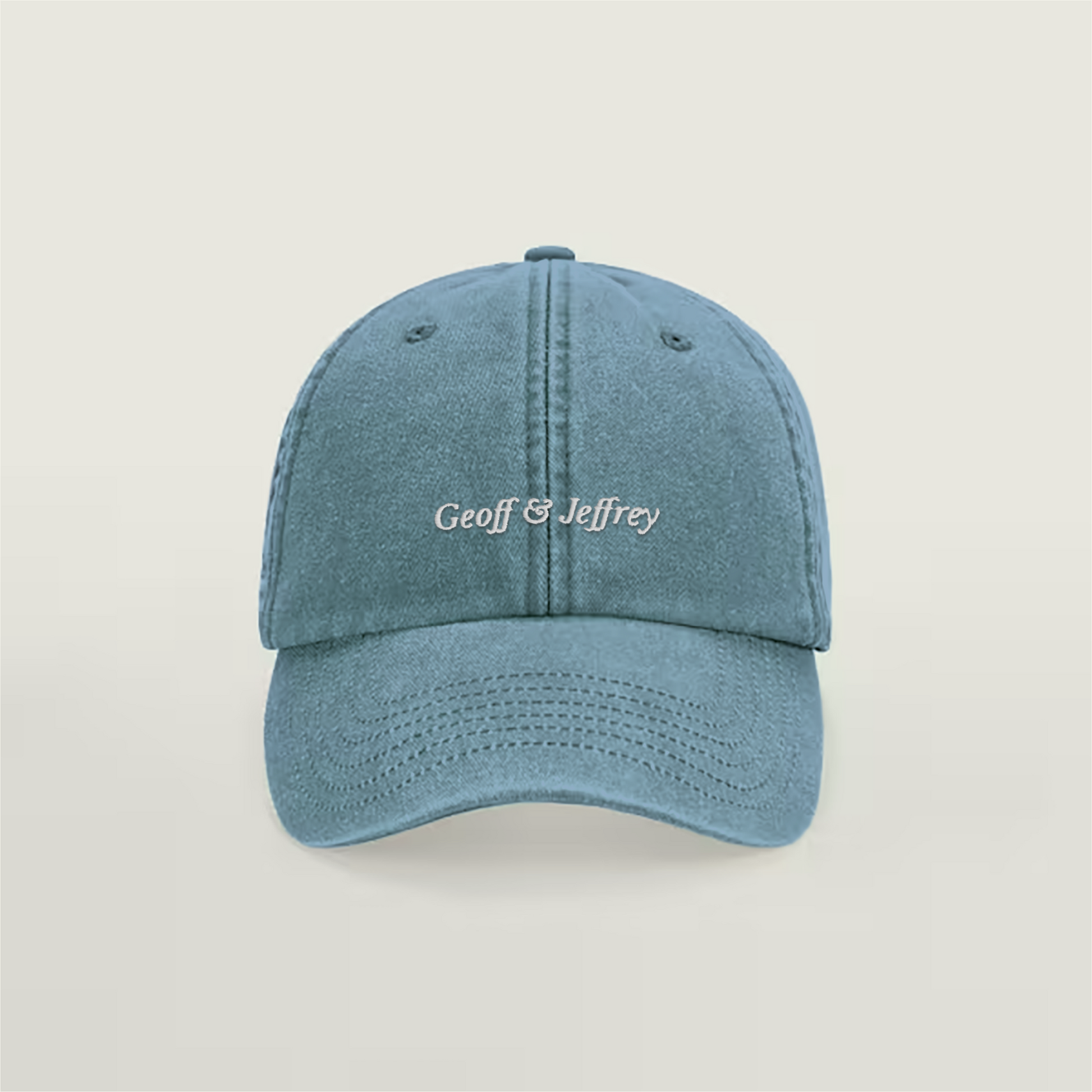 Front view of Geoff & Jeffrey vintage denim blue dad cap with white embroidery