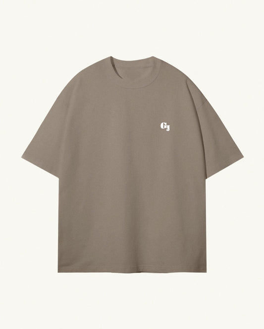 Men's light kaki / brown organic cotton Geoff & Jeffrey front of t-shirt with the brand logo. The t-shirt has a minimal design.