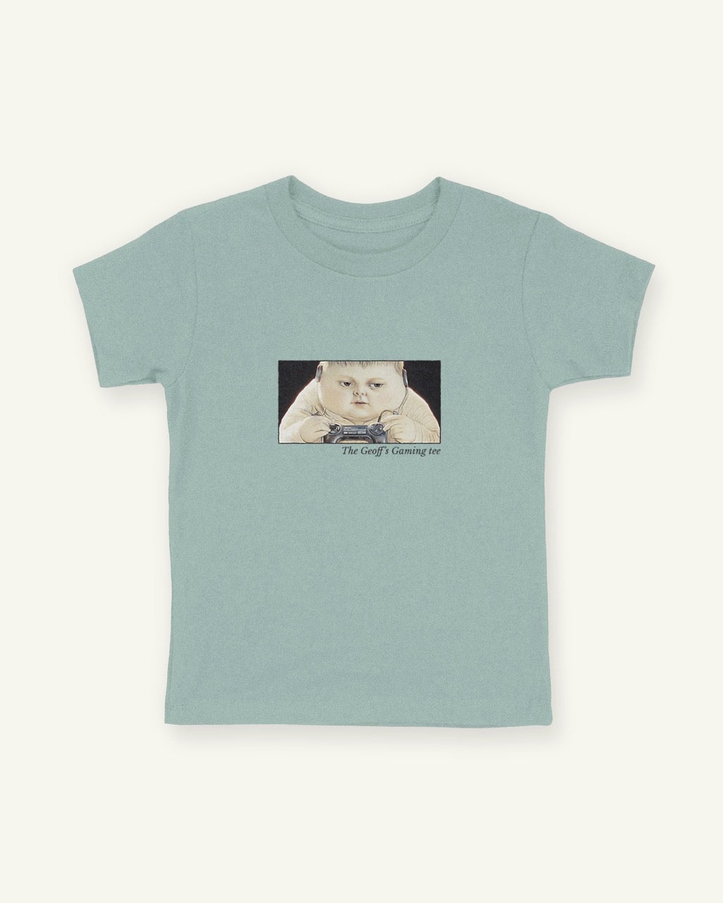 Green fitted children's tee with a framed front print of the boy Geoff gaming with the title below in Libre Baskerville.