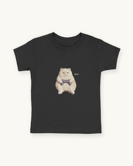 Fitted children's black tee with a front print cutout of the cat Jeffrey gaming with this name in Libre Baskerville.
