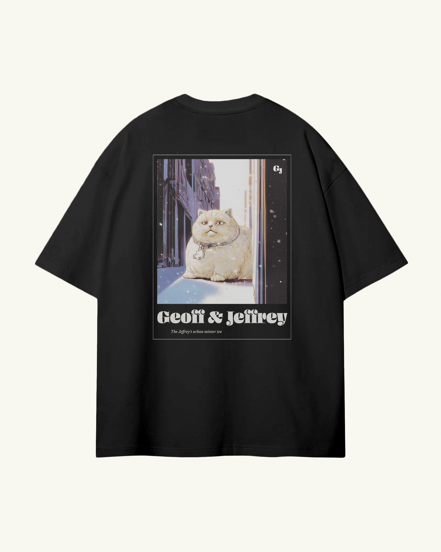 black organic cotton Geoff & Jeffrey unisex tee with drop shoulders  and a large graphic backprint of a joyful, fat cat in the city with snow, with the brandname in ohno blazeface and title in libre baskerville printed below.