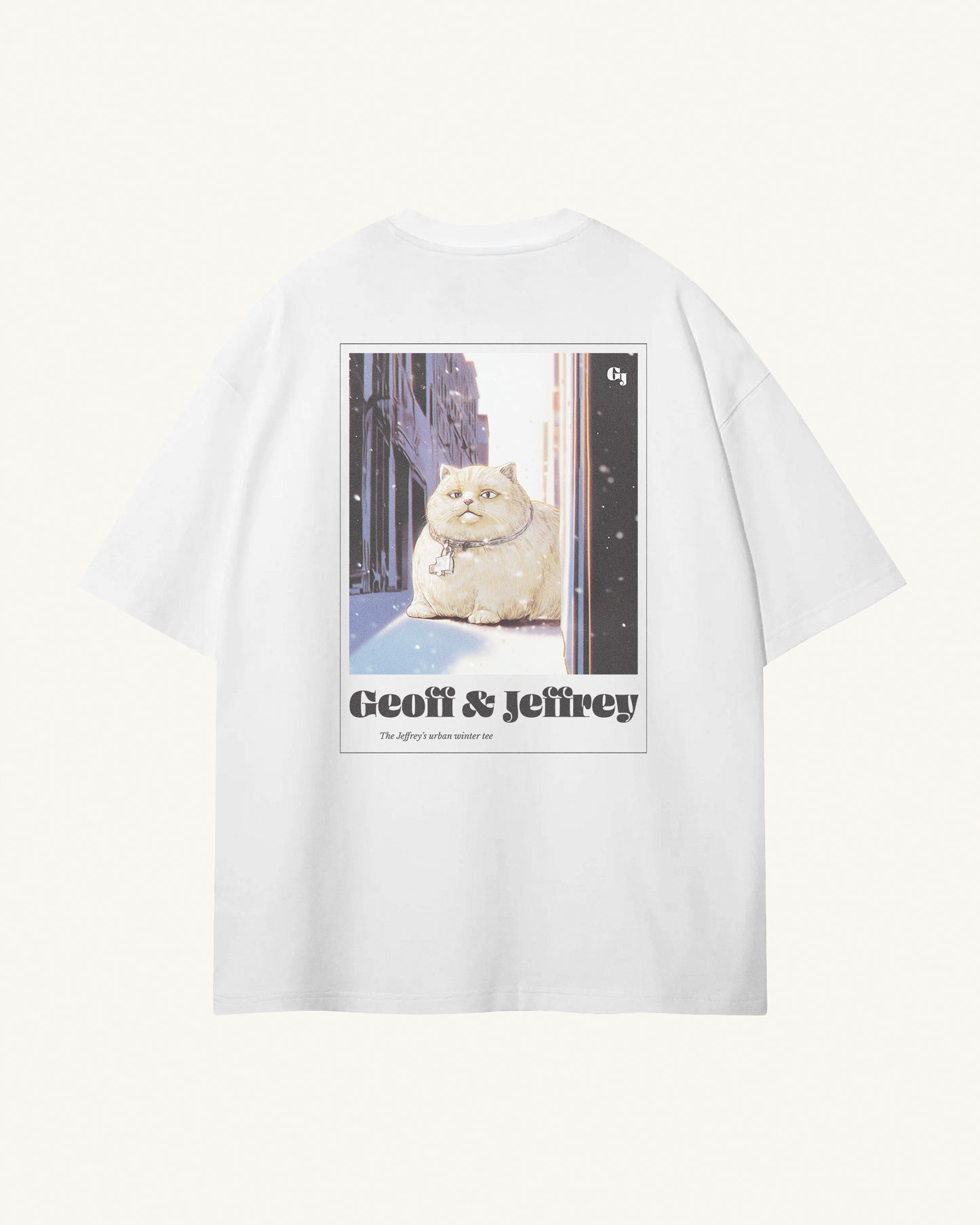white organic cotton Geoff & Jeffrey unisex tee with drop shoulders  and a large graphic backprint of a joyful, fat cat in the city with snow, with the brandname in ohno blazeface and title in libre baskerville printed below.