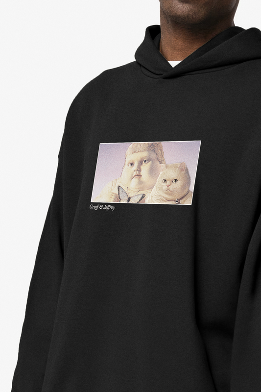 Black Geoff & Jeffrey unisex hoodie with drop shoulders  and a front print of Geoff and Jeffrey with holy halo, with the brandname printed below. 