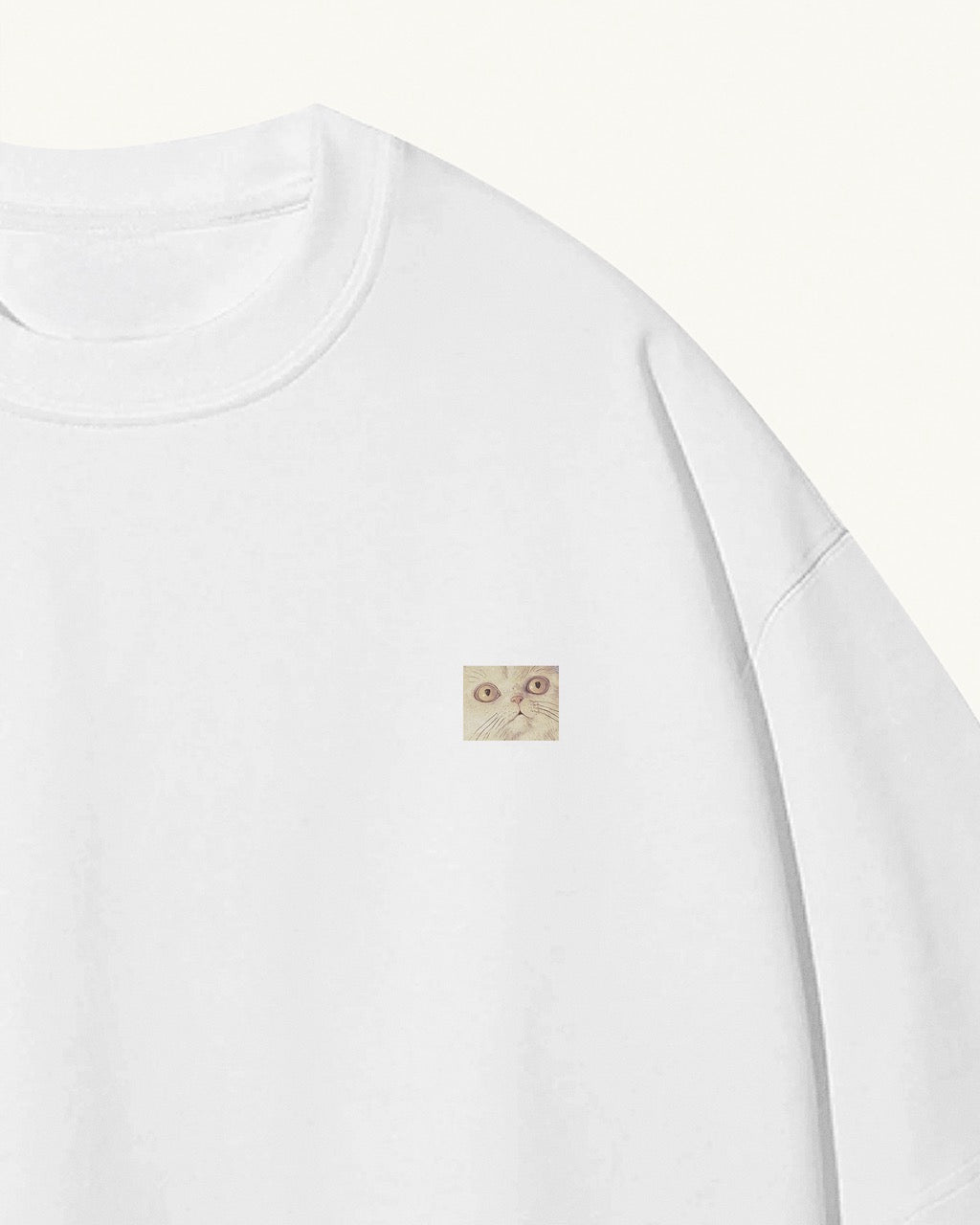 white organic cotton Geoff & Jeffrey unisex t-shirt, front of shirt has a small close up of Jeffrey’s face. The t-shirt has a minimal design.