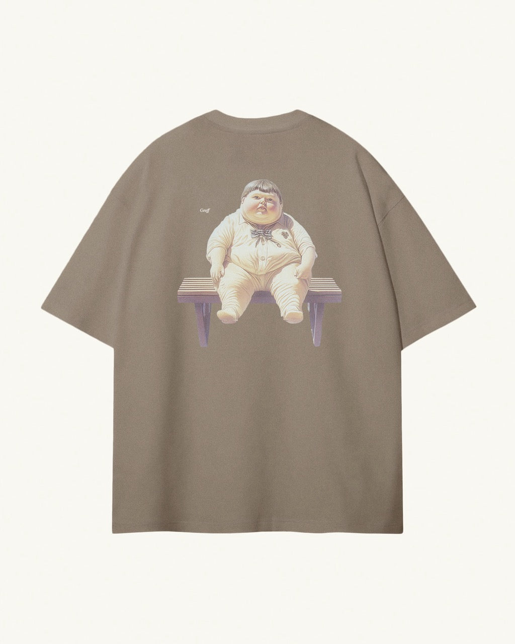 Back of light kaki / brown organic cotton Geoff & Jeffrey unisex t-shirt with drop shoulders and a large graphic backprint of the chubby boy Geoff waiting on a bench, with his name printed aside in elegant font Libre Baskerville. The shirt has a cool aesthetic.