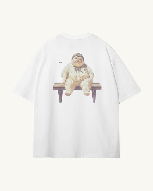 Back of white organic cotton Geoff & Jeffrey unisex t-shirt with drop shoulders and a large graphic backprint of the chubby boy Geoff waiting on a bench, with his name printed aside in elegant font Libre Baskerville. The shirt has a cool aesthetic.
