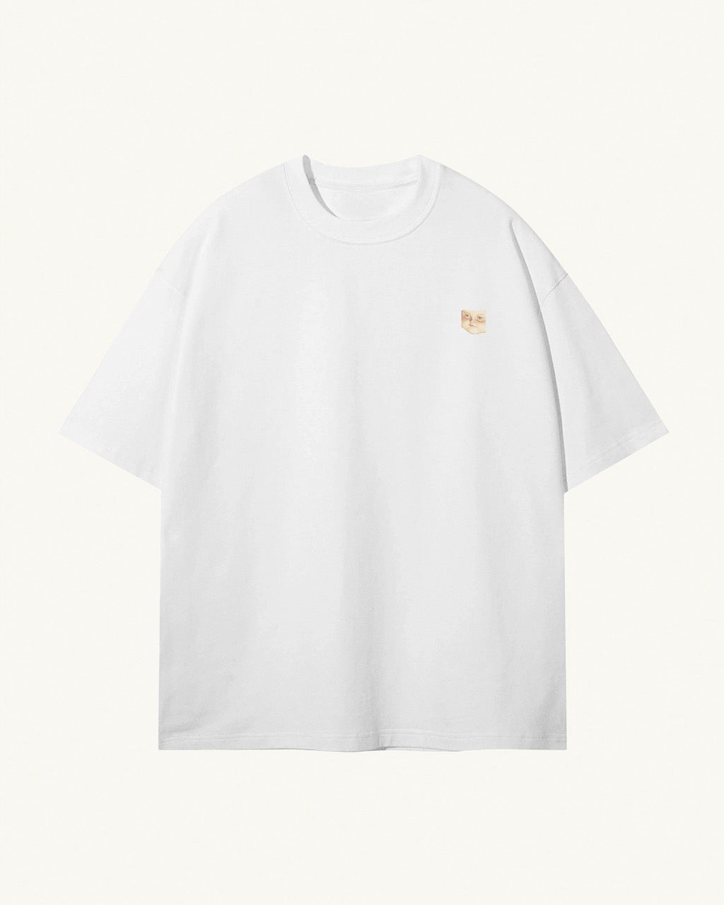 white organic cotton Geoff & Jeffrey unisex t-shirt with drop shoulders. The front of the shirt has a small close up of geoff’s face and a minimal design.