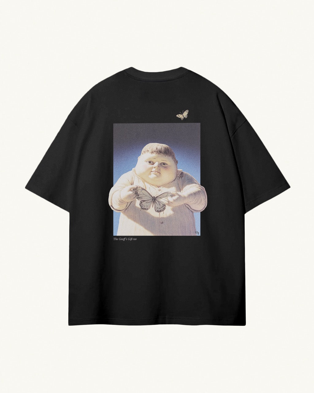 black organic cotton Geoff & Jeffrey unisex t-shirt with drop shoulders and a large graphic backprint of the jolly boy Geoff holding a butterfly,with the title printed below. The shirt has a cool aesthetic.