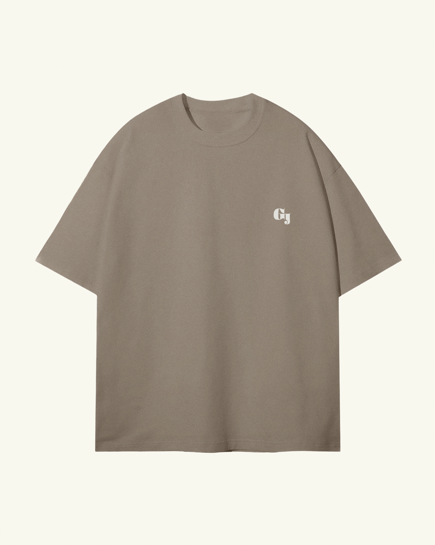 light kaki brown organic cotton Geoff & Jeffrey, unisex t-shirt with drop shoulders and the brand logo on the front. The shirt has a minimal design.