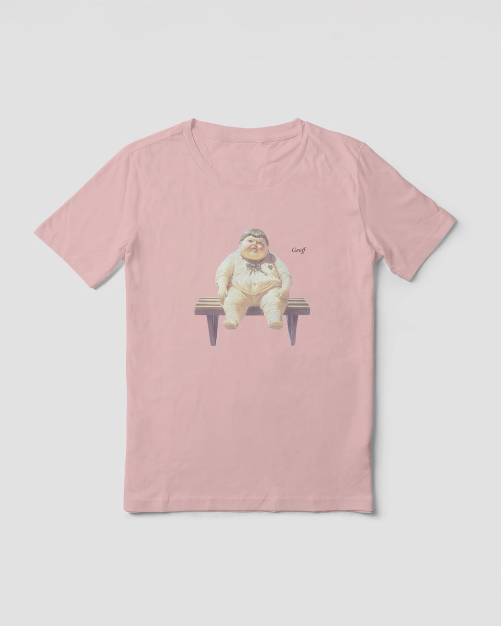 Women's soft pink organic cotton Geoff & Jeffrey t-shirt with a graphic print of a jolly, proud boy (Geoff) sitting on a bench, waiting, with his name 'Geoff' subtly printed in Libre Baskerville next to the image. The t-shirt has a weird aesthetic