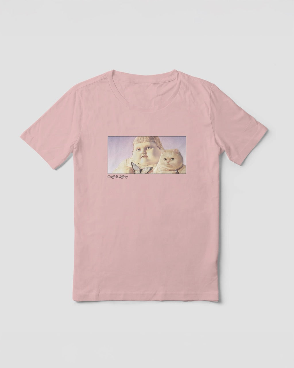 Women's soft pink organic cotton Geoff & Jeffrey t-shirt with a framed graphic print of the jolly, proud boy (Geoff) and his funny fat cat (Jeffrey), holding a butterfly, with there names subtly printed in Libre Baskerville below the image. The t-shirt has a dreamy aesthetic.