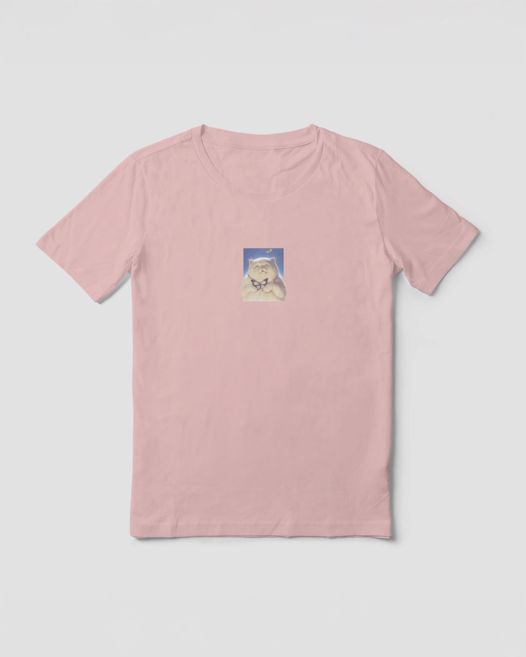 women's pink organic cotton Geoff & Jeffrey t-shirt with a small graphic print of a funny fat cat (Jeffrey) holding a butterfly. The t-shirt has a cute aesthetic