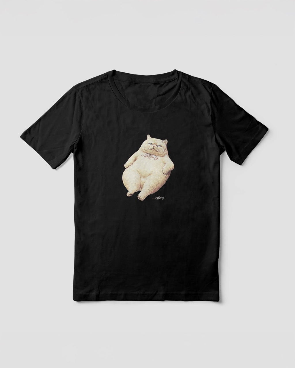 Mock up of a women's t-shirt in black with a front print illustration of Jeffrey (from the funny duo Geoff & Jeffrey). The fat cat that is lying on his back, looking annoyed, rolling his eyes. In the bottom his name is written in an elegant font: Libre baskerville.