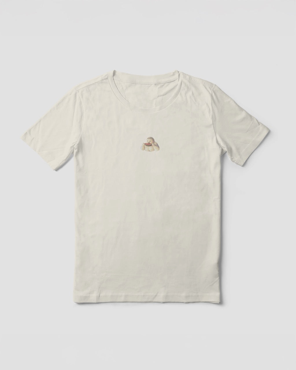 Women's off-white natural organic cotton Geoff & Jeffrey t-shirt with a graphic print of a jolly, proud boy (Geoff) smiling and eating a watermelon, with his name 'Geoff' subtly printed in Libre Baskerville below the image. The t-shirt has a cute aesthetic