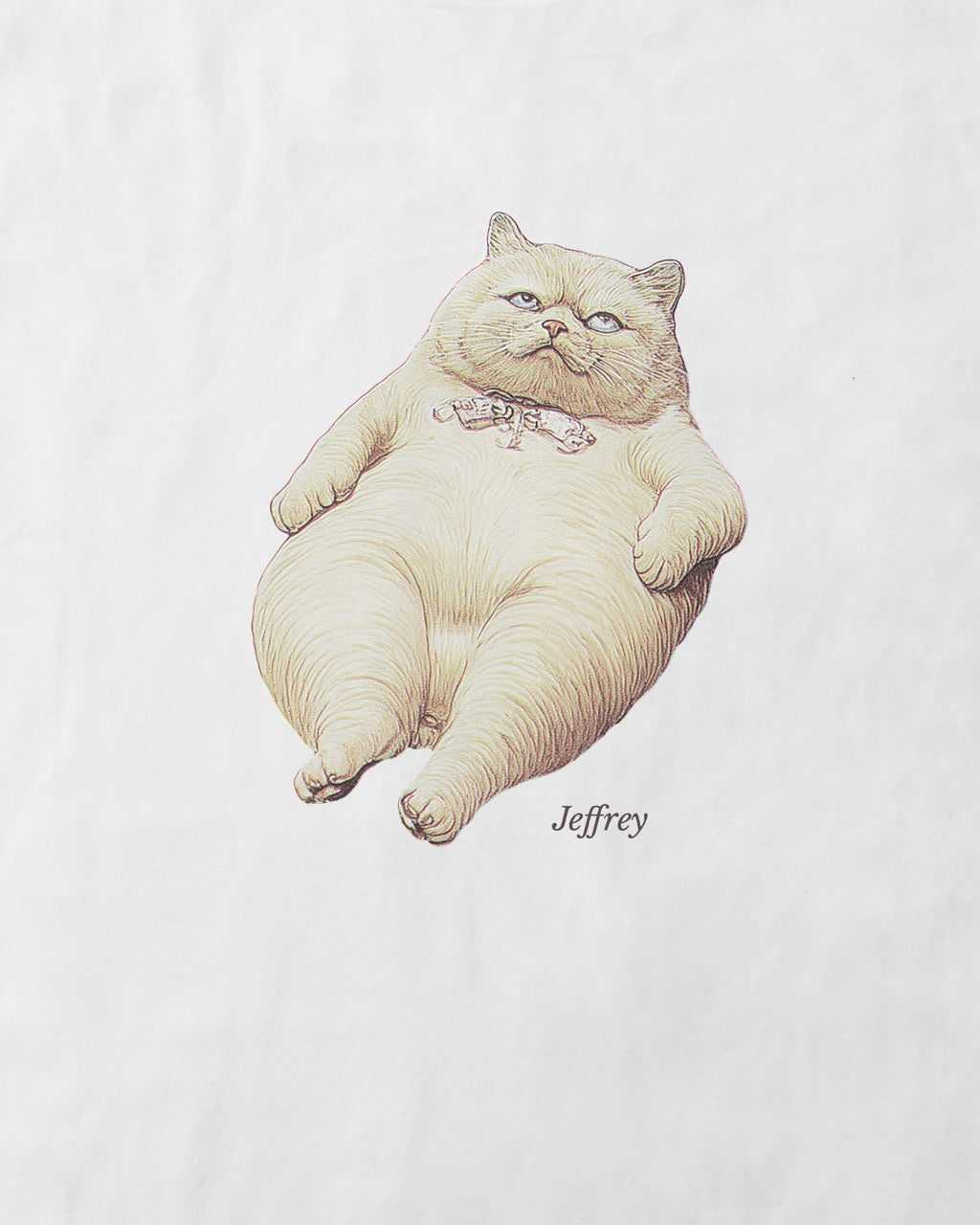 Close up of a women's t-shirt in white with a front print illustration of Jeffrey (from the funny duo Geoff & Jeffrey). The fat cat that is lying on his back, looking annoyed, rolling his eyes. In the bottom his name is written in an elegant font: Libre baskerville.