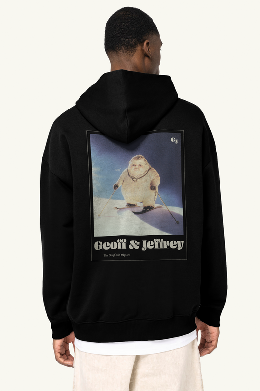 Person wearing a black hoodie with 'Geoff & Jeffrey' graphic on the back. Geoff on skis