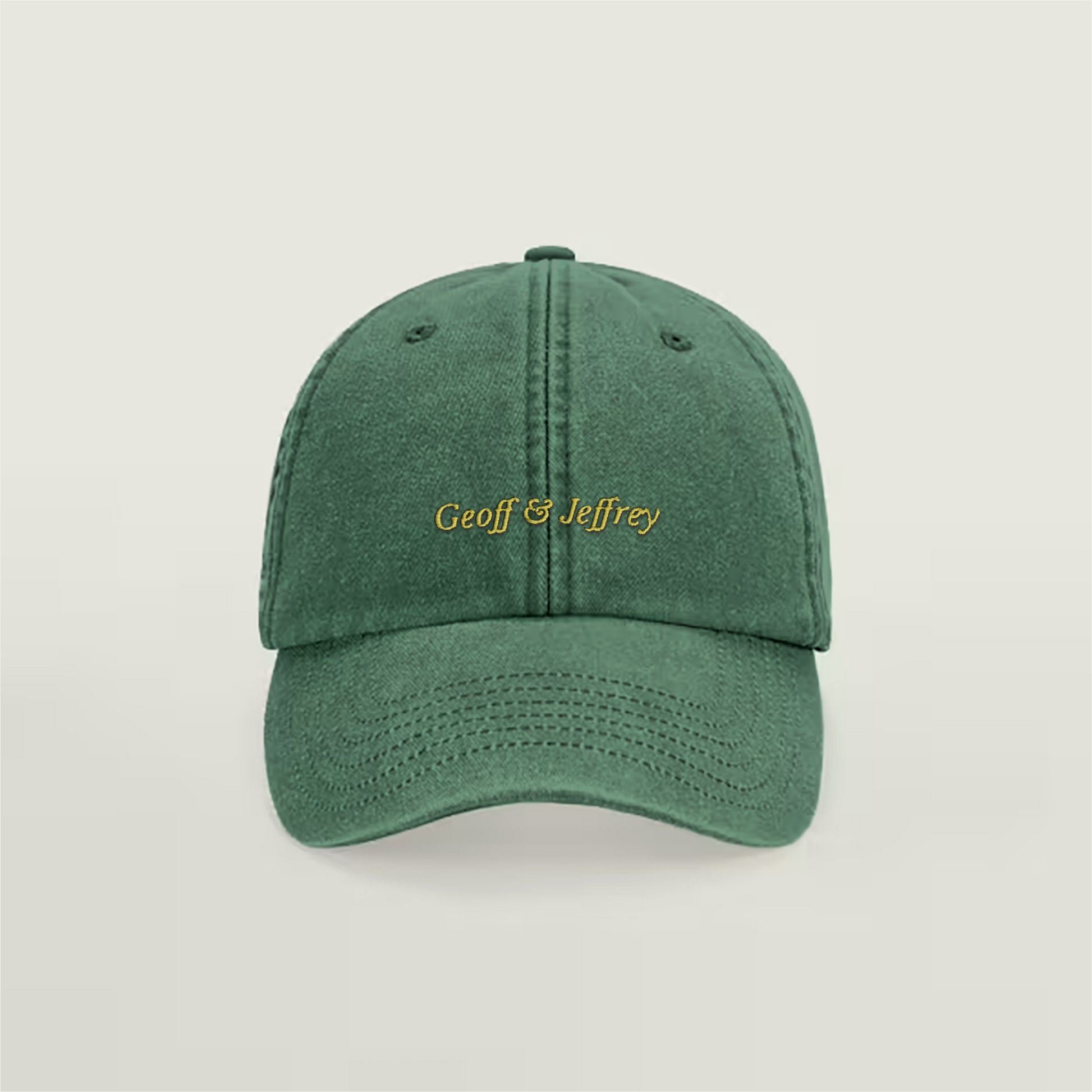 Front view of Geoff & Jeffrey vintage bottle green dad cap with yellow embroidery