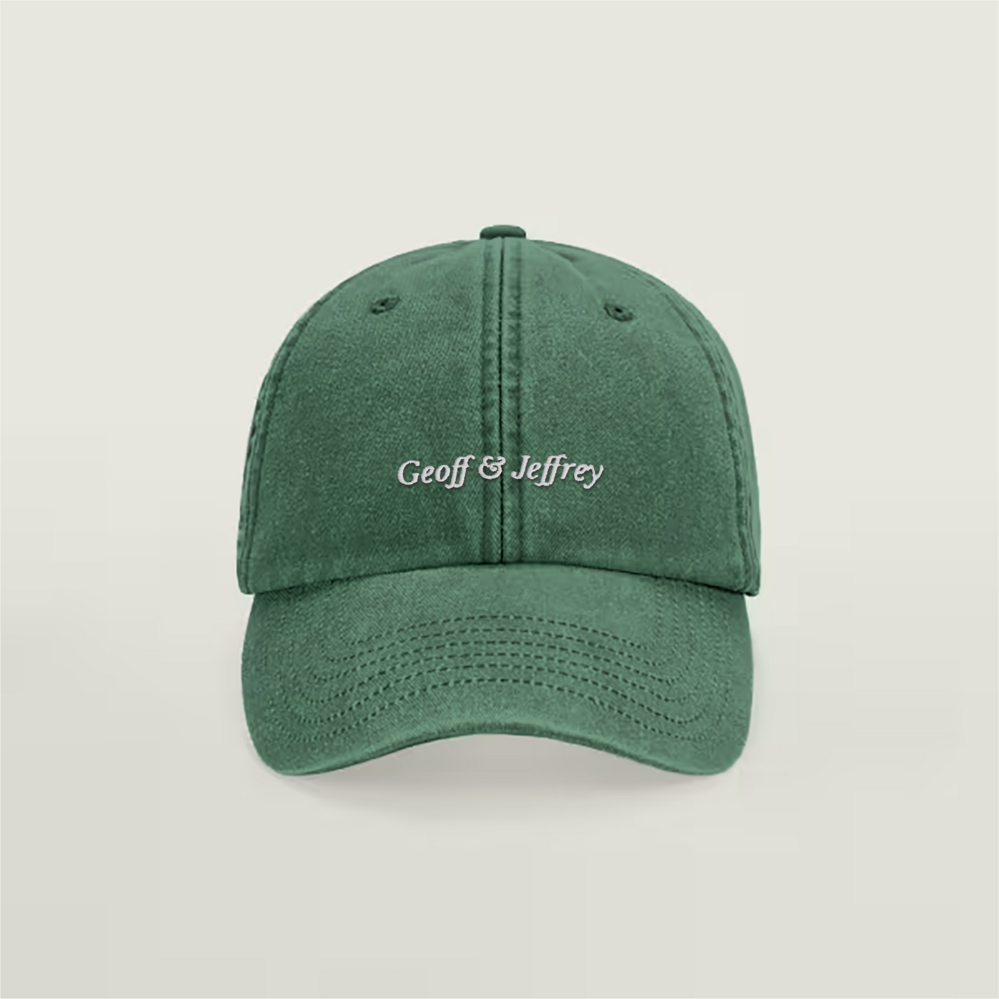 Front view of Geoff & Jeffrey vintage bottle green dad cap with white embroidery