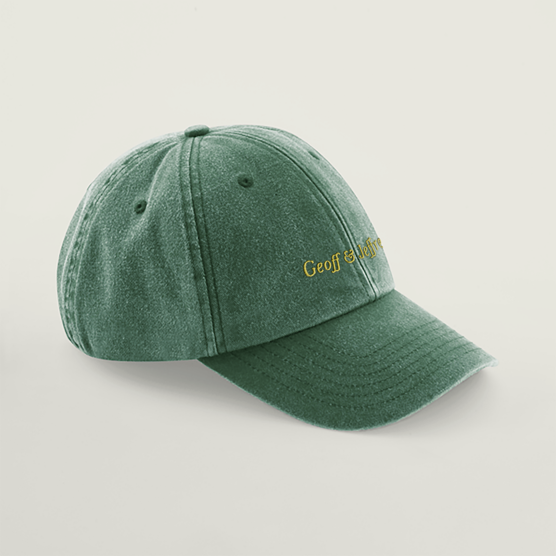 Side view of Geoff & Jeffrey vintage bottle green dad cap with yellow embroidery