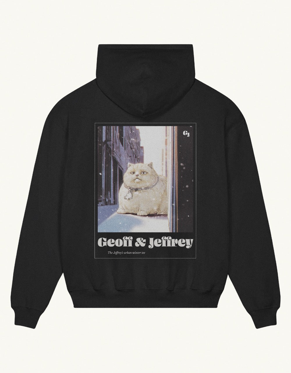 Black organic cotton Geoff & Jeffrey hooded sweater with drop shoulders  and a large graphic backprint of a joyful, fat cat in the snowy city with the brandname in ohno blazeface and title in libre baskerville printed below.