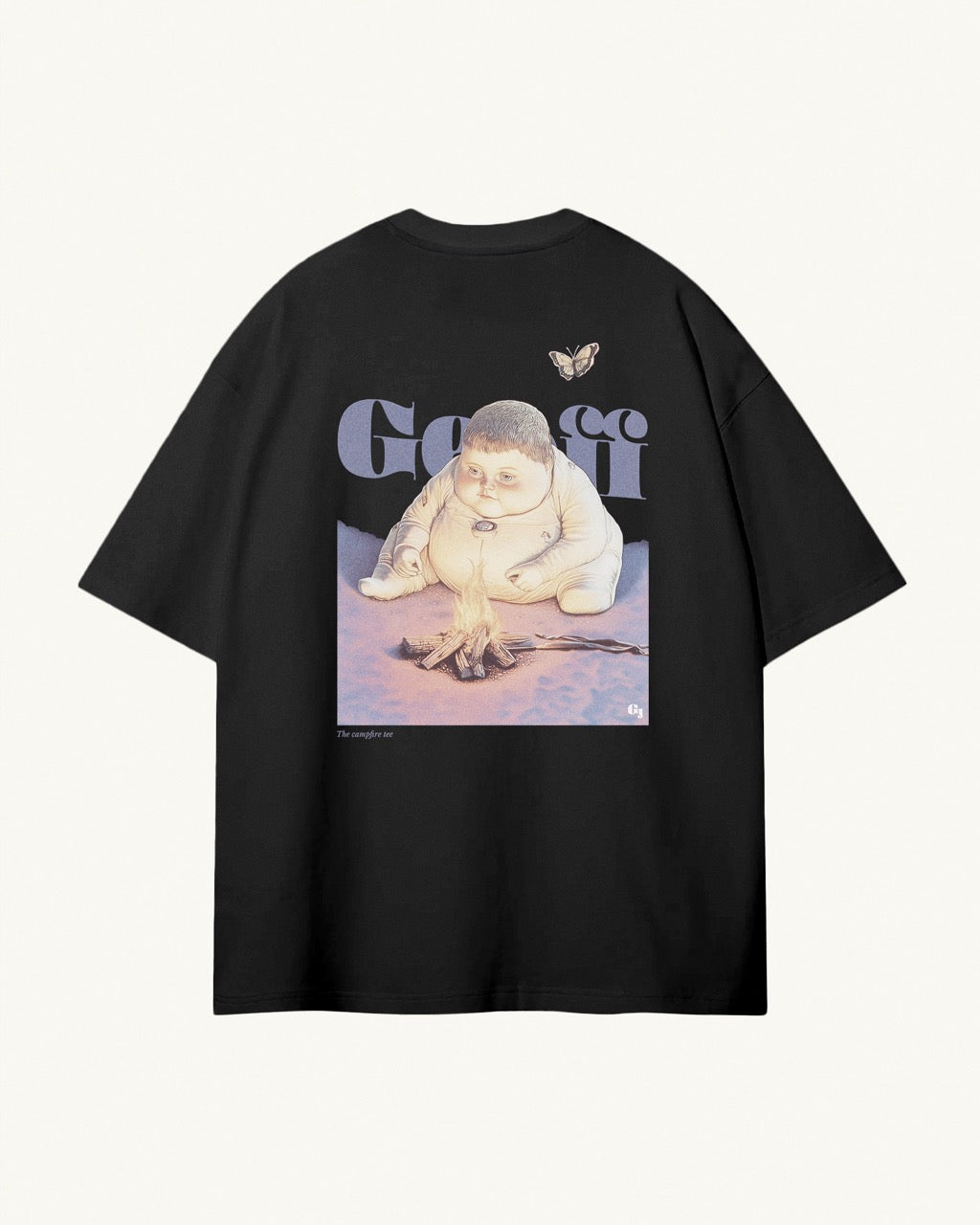 black organic cotton Geoff & Jeffrey unisex t-shirt with drop shoulders and a large back print of the cute boy Geoff sitting by the fire with butterfly. His name large behind Geoff and the title printed below. The shirt has a retro aesthetic.